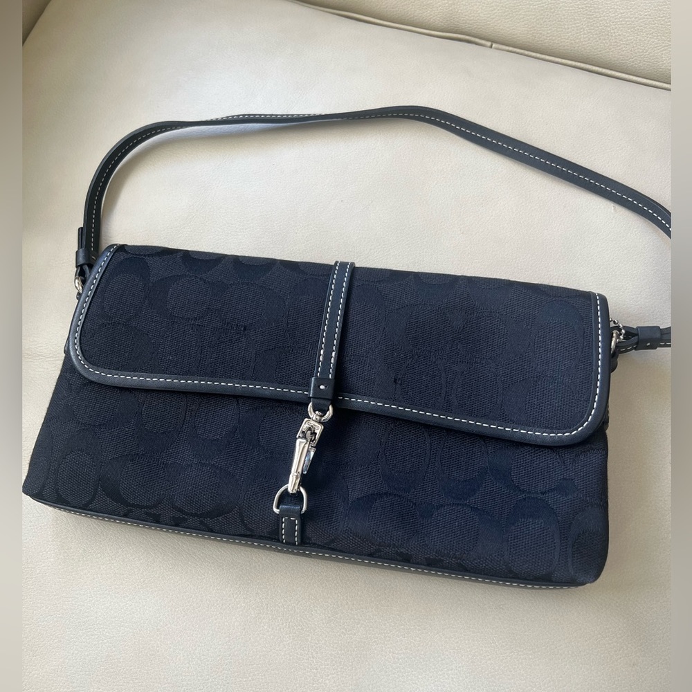 Coach hand bag black and silver.